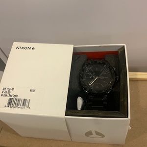 Nixon black crystal watch.
